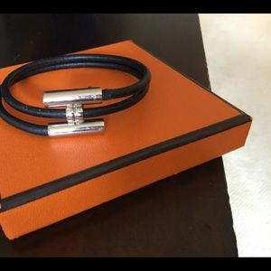 Hermès silver H with black leather bracelet